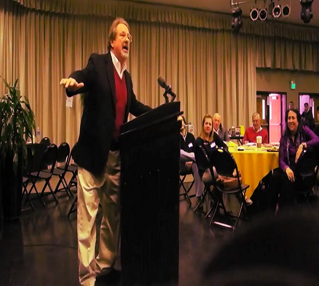 mike-veeck-speaking-at-podium-from-side